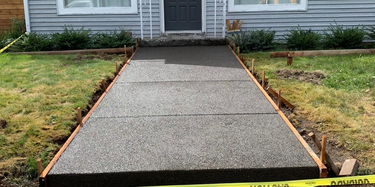 Concrete Walkway Contractors: Improving Your Property's Curb Appeal